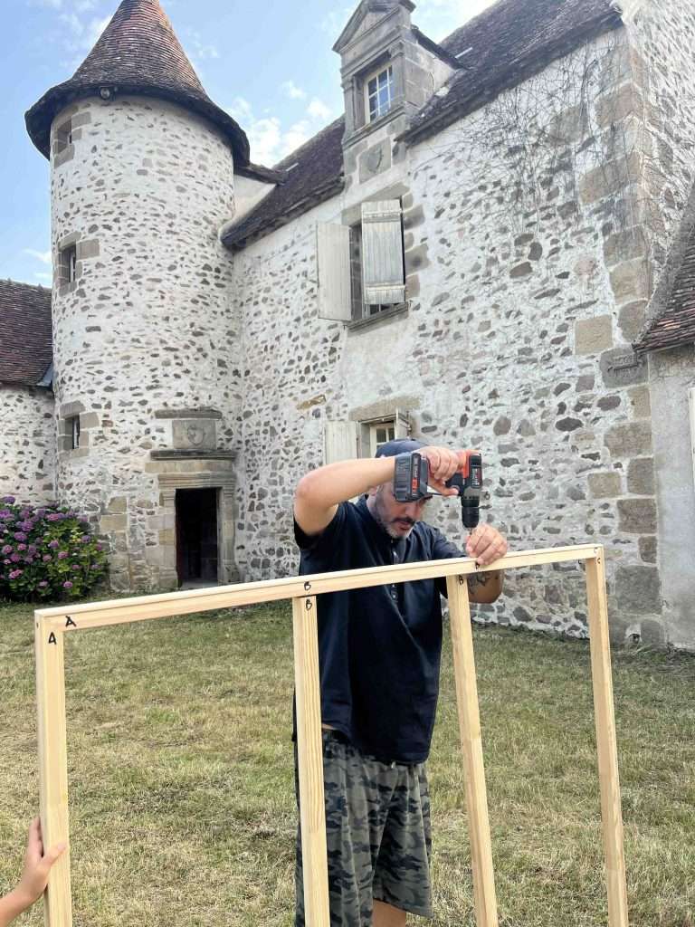 The stretcher was delivered in pieces and assembled on site by the artist. Once constructed, the canvas was carefully stretched and mounted onto the frame.